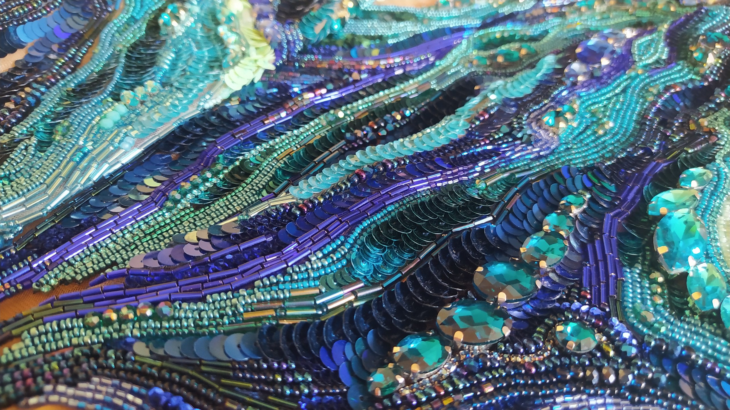 Iridescent blue-green embroidery